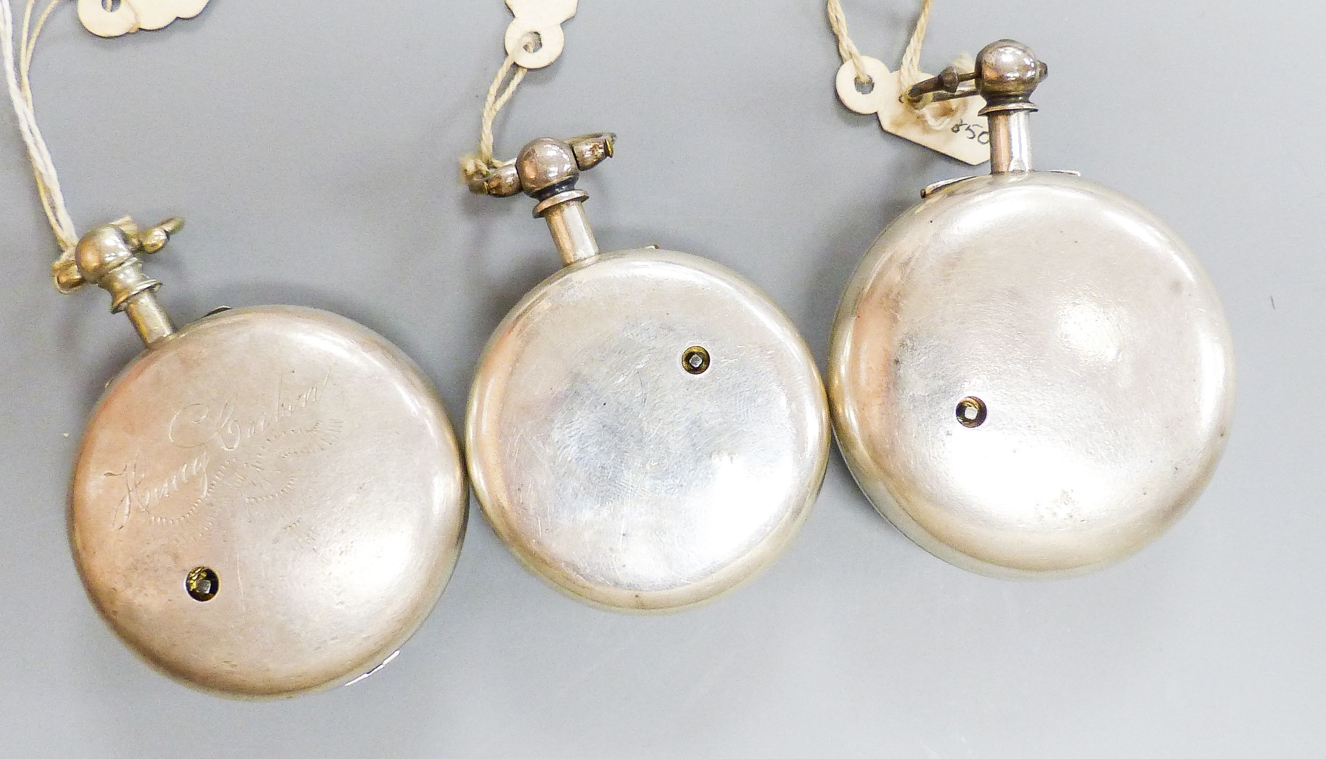 Three 18th/19th century silver pair cased keywind verge pocket watches, including Newland, London.